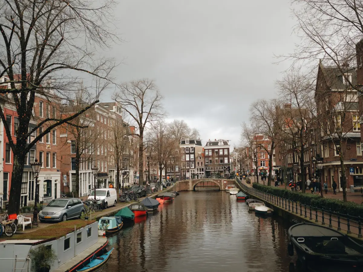 KLM reward flights to Amsterdam — historic canal, boats, and townhouses